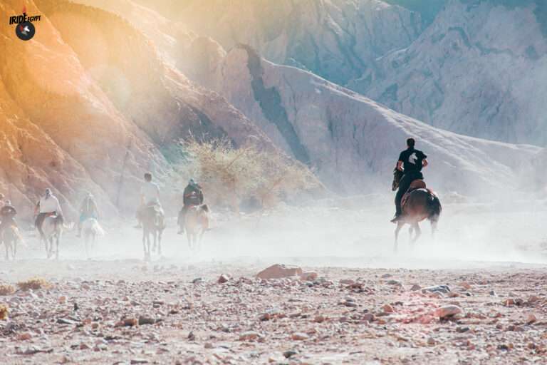 Group ride in the desert dust of the Dahab mountains