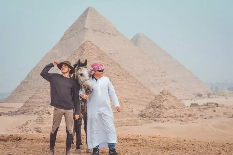 Guest and guide with an Arabian horse at the Pyramids