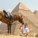 Guest with a chestnut Arabian horse at the Great Pyramids